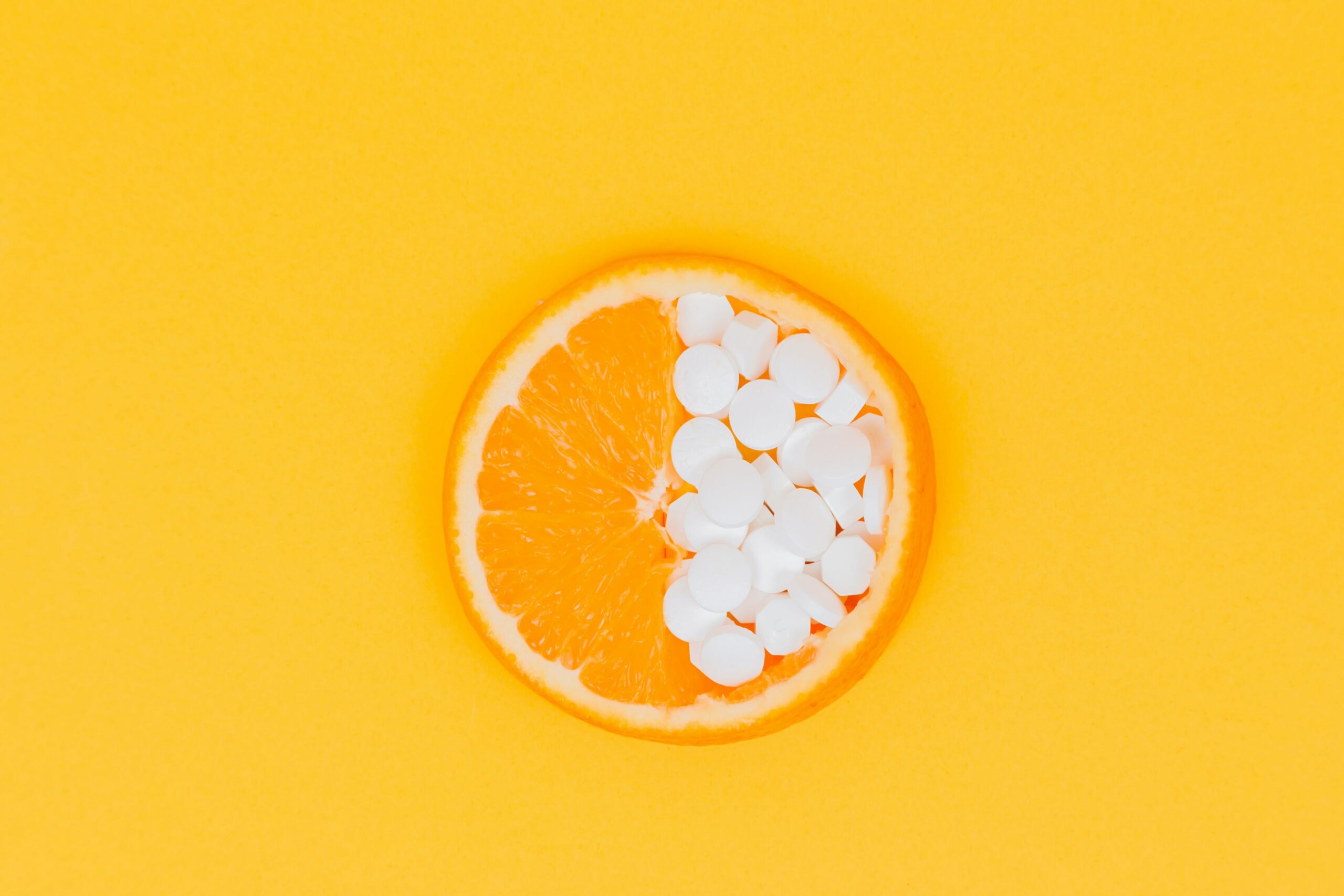 sliced orange fruit halved with pills