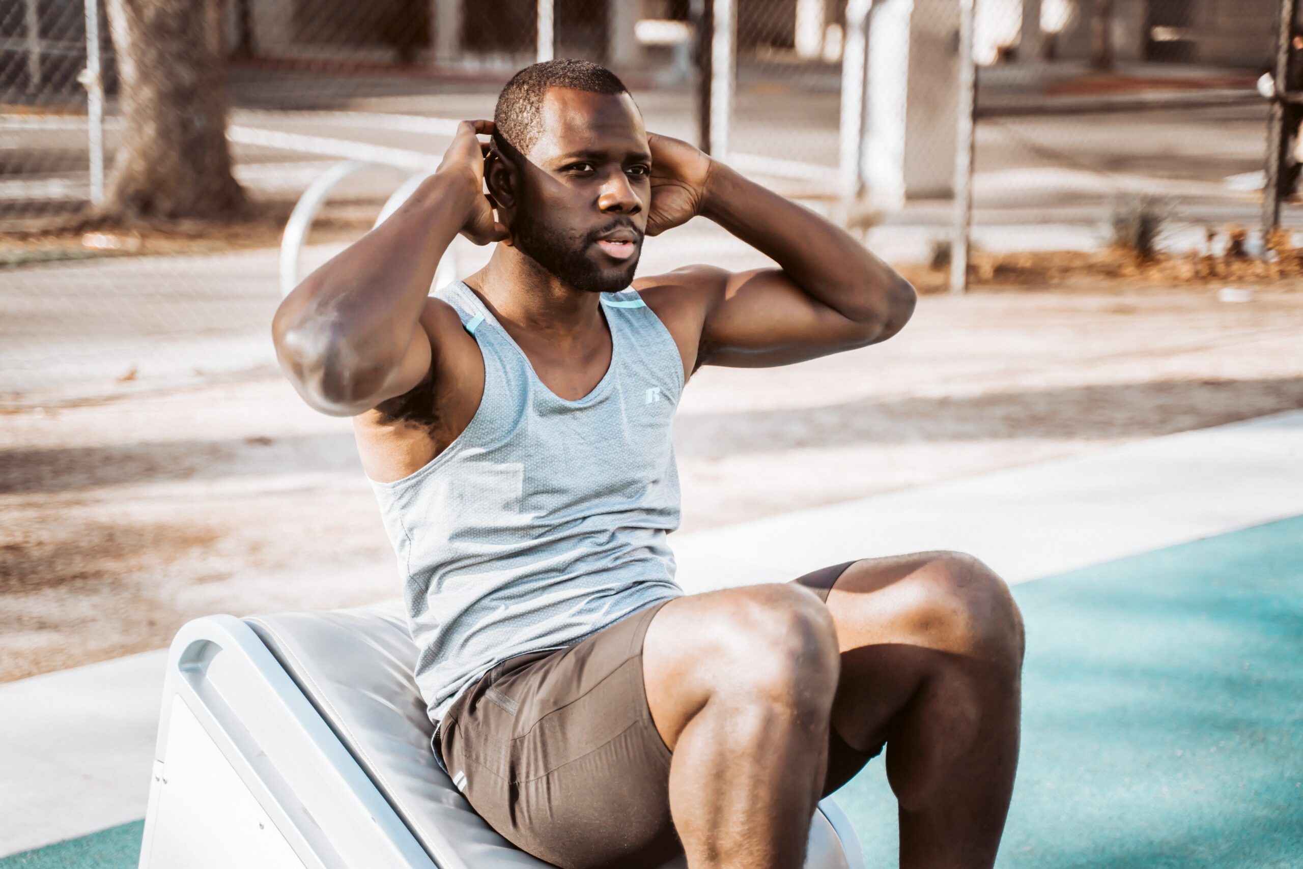 a man doing sit ups in the park