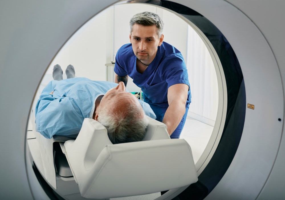 A doctor preparing a patient for an MRI scan
